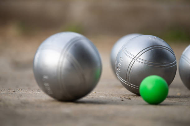 istock Petanque balls in the playing field with shady as a backdrop. 1641064321
