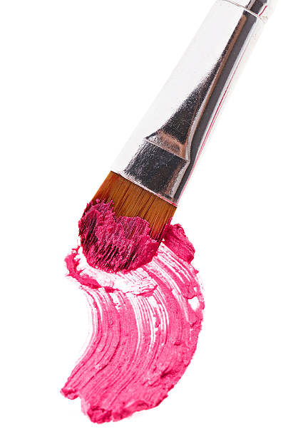 istock Pink lipstick stroke (sample) with makeup brush, isolated 164106689