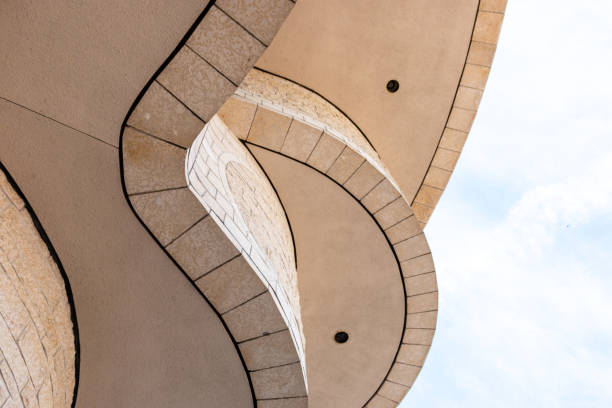 Portrait of woman standing on the background of futuristic architecture (Kyiv Crematorium)