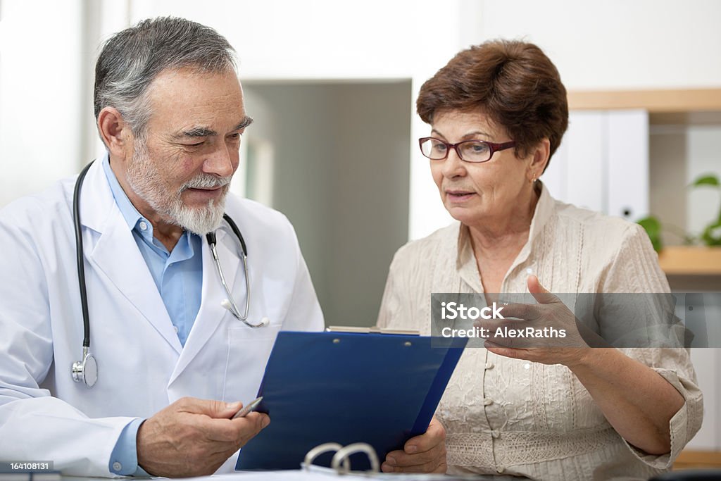 Medical exam Patient tells the doctor about her health complaints Doctor Stock Photo