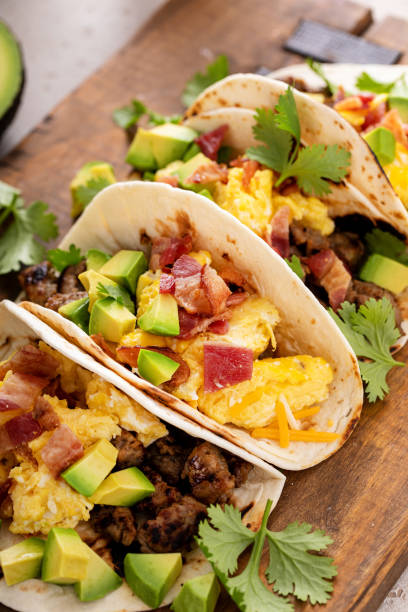istock Breakfast tacos with sausage, eggs, bacon and avocado 1641083233