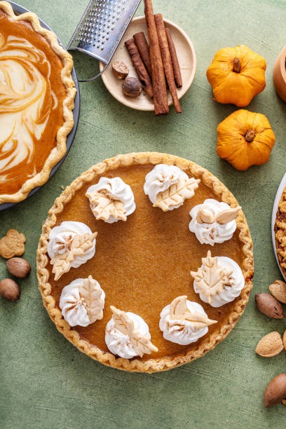 istock Traditional pumpkin pie for Thanksgiving with whipped cream 1641084330