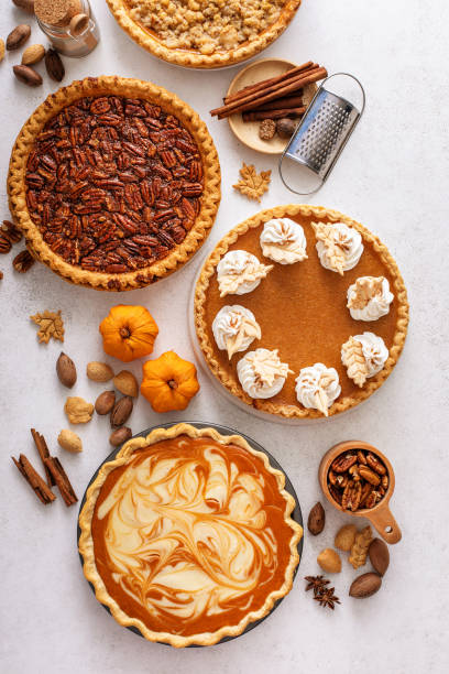 istock Traditional Thanksgiving pies with pumpkin pie in the middle 1641084335