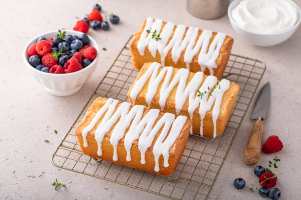 istock Classic pound cake with powdered sugar glaze dripping over 1641095791