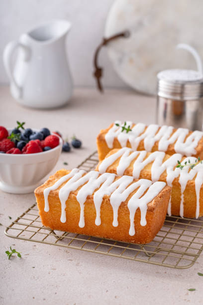 istock Classic pound cake with powdered sugar glaze dripping over 1641097948