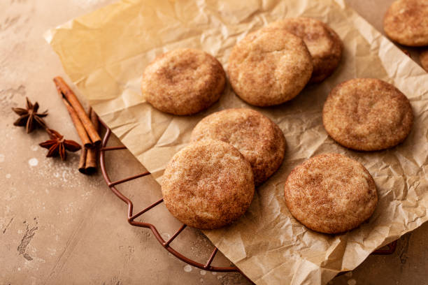 istock Cinnamon cookies on a parchment paper with milk 1641098536