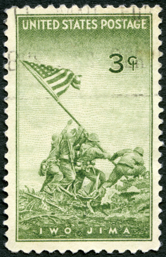 USA 1945 postage stamp printed in the USA shows Marines Raising the Flag on Mount Suribachi, Iwo Jima, from a Photograph by Joel Rosenthal, Achievements of the U.S. Marines in WWII, circa 1945