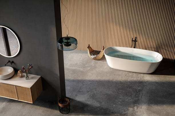 istock Comfortable bathtub and vanity with basin standing in modern bathroom black blue and wooden walls and concrete floor 1641106496