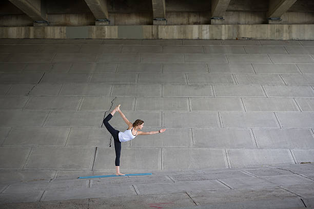 istock Girl doing yoga on cement 164110893
