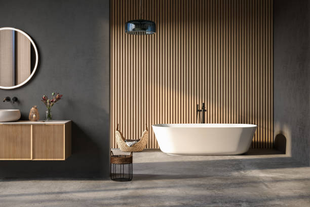 istock Comfortable bathtub and vanity with basin standing in modern bathroom black blue and wooden walls and concrete floor.Front view 1641114342