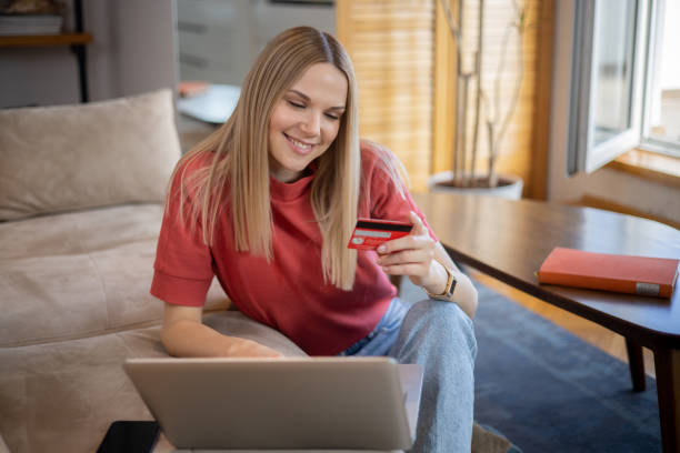 istock Happy young customer enjoys shopping online 1641118671
