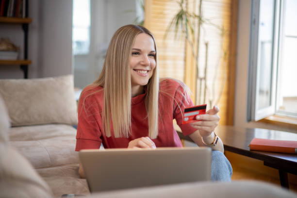istock Happy young customer enjoys shopping online 1641120291