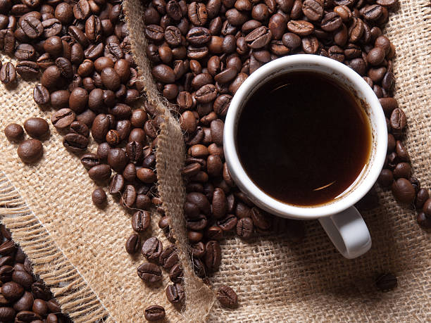 cup of coffee on burlap background stock photo