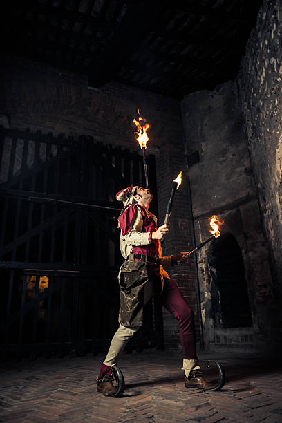 istock Street Performer Jester with Torch 164114483