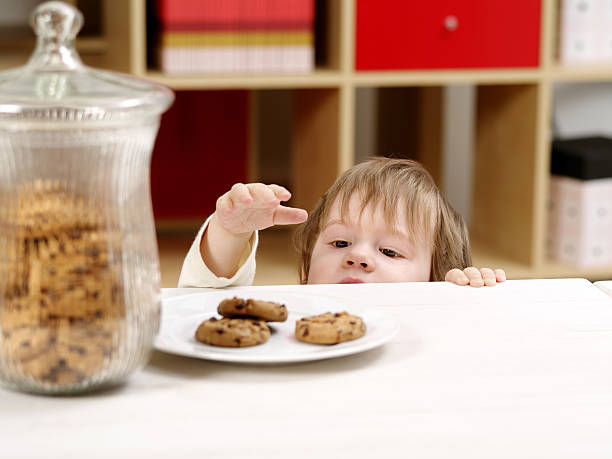istock Little boy stealing cookies 164114602
