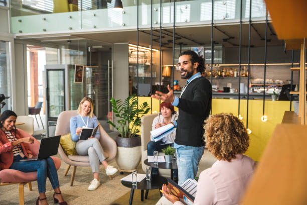 Middle Eastern CEO Welcoming Colleagues At A Business Meeting