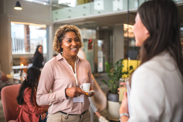 istock Cheerful Diverse Businesswomen Sharing Knowledge At Business Seminar 1641154019