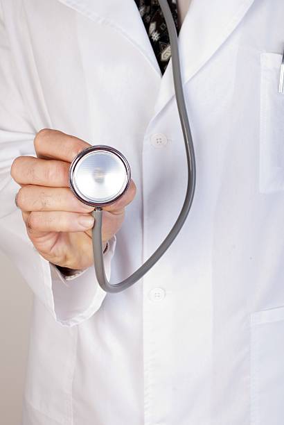 istock Close up of a doctors lab white coat 164115513