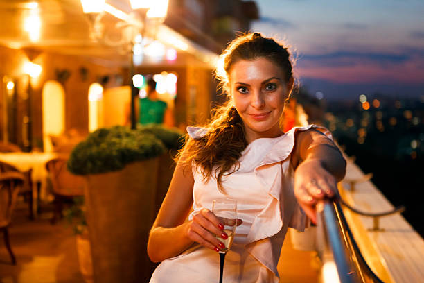 Young beautiful woman on night party went to get some air
