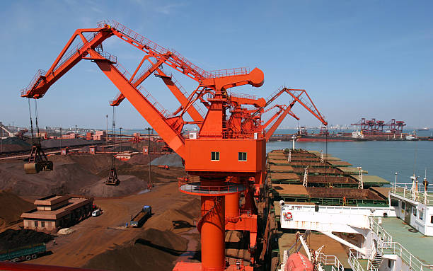 Ore terminal Qingdao Port, China iron ore terminal level luffing crane stock pictures, royalty-free photos & images