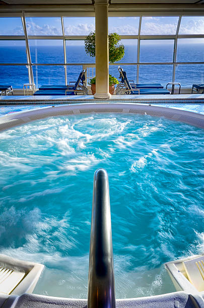 Cruise Ship hot tub Ship's hot tub depicted at sea in early morning light drinks on the deck stock pictures, royalty-free photos & images