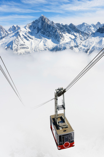 Courmayeur, Italy - February 20, 2020: Alpine cable car Skyway Monte Bianco from Courmayeur to Punta Helbronner with scenic views of Mont Blanc massif and Alps. Aosta Valley.
