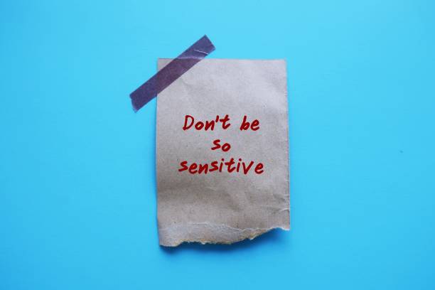 istock Torn paper stick on blue background with handwriting Don't Be So Sensitive, gaslighting message to accuse or emotional abuse others to question their beliefs or doubt their perceptions and become distressed 1641222817