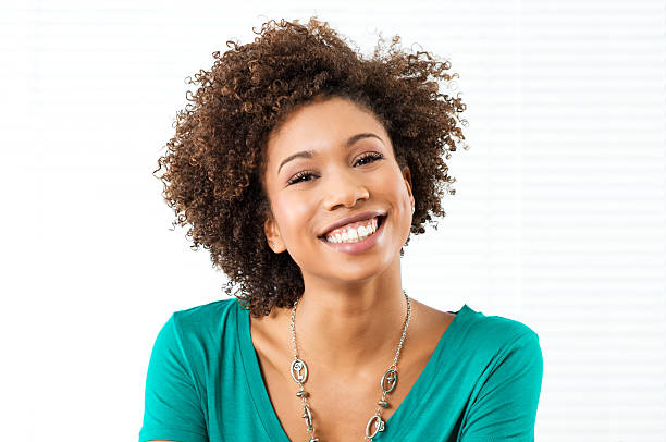 Woman Smiling at the camera against a white background