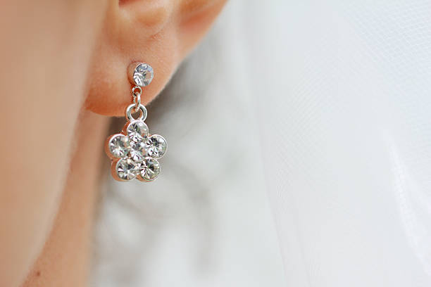 Earring Earring in his ear close up earring stock pictures, royalty-free photos & images