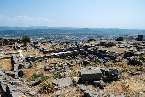 Located in the Bakırçay Basin, north of Izmir, Bergama is one of the most important settlements in the history of civilization and was founded on the ancient city of Pergamon. Although the history of the region dates back to the Bronze Age, the earliest finds on the top of the castle where the ancient city of Pergamon was founded date back to the 7th to 6th centuries BC.\n\nThe city came to the forefront during the Hellenistic Period and served as the capital of the Kingdom of Pergamon, which was established during this period. There are many civil architecture examples such as mosques, inns, baths, fountains, synagogues, synagogues, covered bazaars, etc. bearing the traces of Hellenistic, Roman, Byzantine, Seljuk and Ottoman periods. The city, which smells of history, is an open-air museum like many districts of Izmir and is one of the richest districts of Izmir in terms of culture.