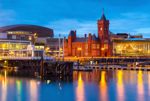 Cardiff Bay at dusk, the Pierhead building (1897) and National Assembly for Wales can be seen over the water.