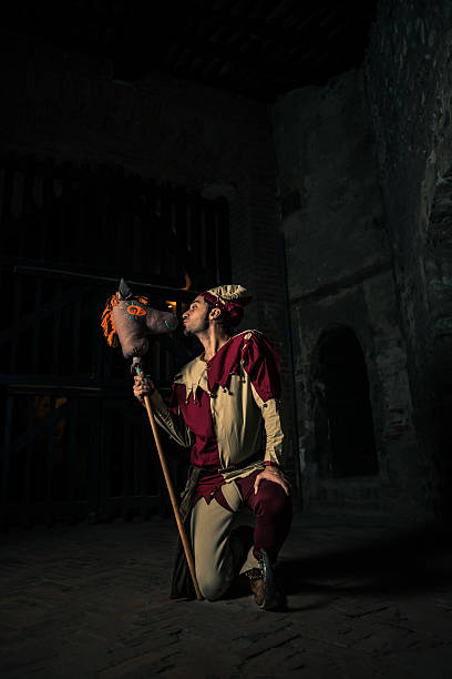 istock Street Performer Jester with Horse Puppet 164123018