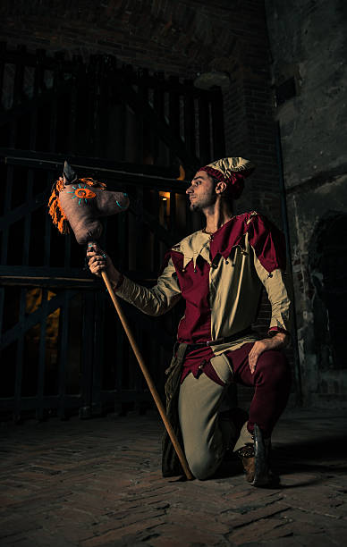 istock Street Performer Jester with Horse Puppet 164123022