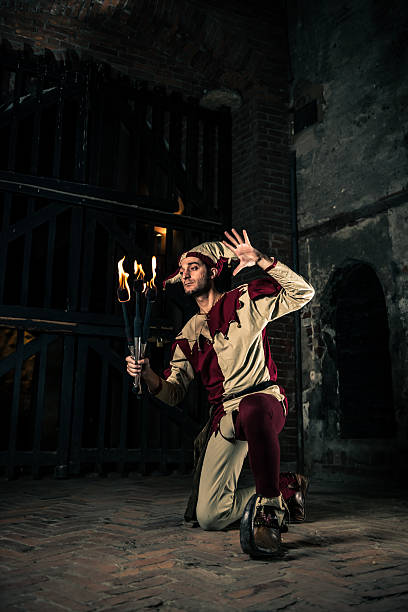 istock Street Performer Jester with Torch 164123026