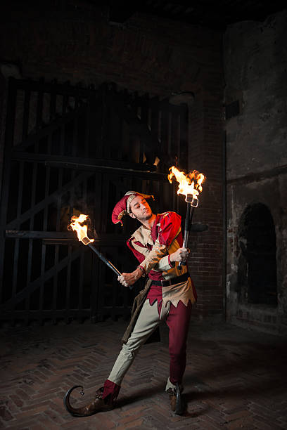 istock Street Performer Jester with Torch 164123037