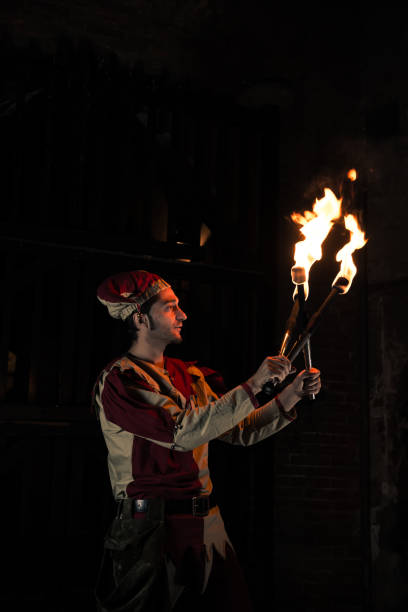 istock Street Performer Jester with Torch 164123058
