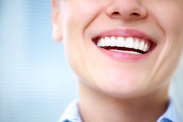 female smile Close-up of female smile with healthy teeth caucasian ethnicity stock pictures, royalty-free photos & images