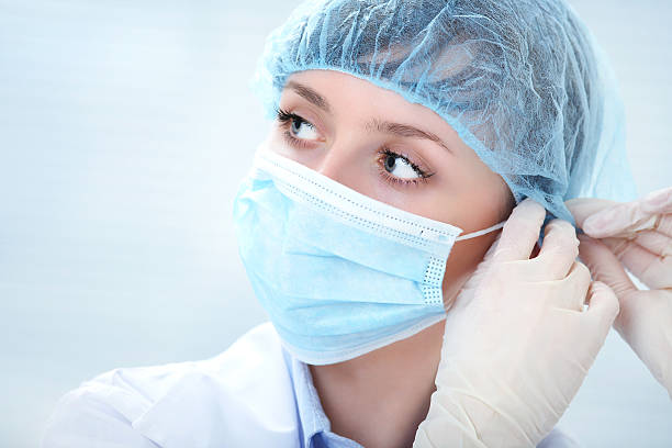 female doctor in medical gloves stock photo