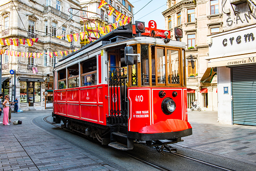 Istanbul, Turkey - August 21, 2023: Nostalgic Red Tram of Istanbul. Historic tram in Taksim Istiklal Street. Touristic popular destination Taksim Istiklal Street. Beyoglu, Istanbul, Turkey.