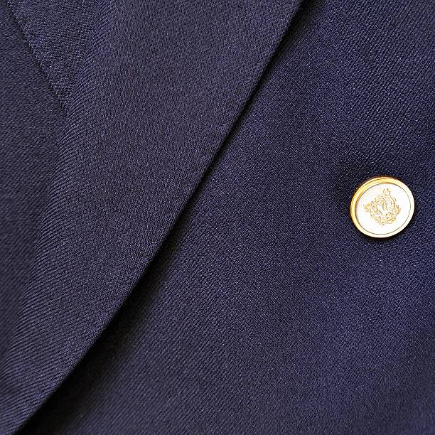 Wool suit Close-up of a classic blue wool suit with button. coat wool button clothing stock pictures, royalty-free photos & images