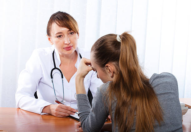 istock Doctor with female patient 164133525