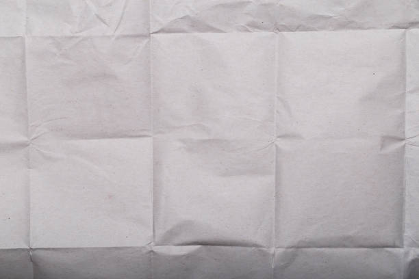 istock Folded grunge white paper background texture, asset for graphic design 1641352279