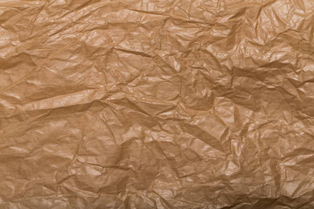 istock Crumpled grunge brown paper background texture, asset for graphic design 1641413692