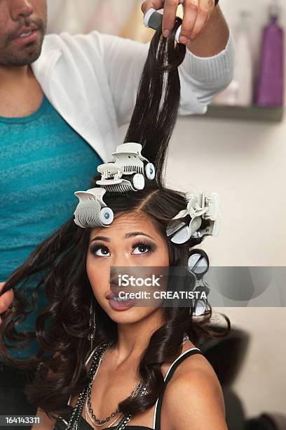 Young Woman Watches Curler Removal Stock Photo - Download Image Now - Adult, Asian and Indian Ethnicities, Beautiful People
