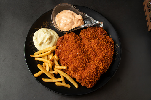 Fried fish fry and chip with mayo dip served in dish isolated on background top view of bangladesh and indian food