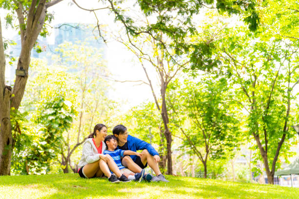 istock Asian family playing together at park. 1641459944