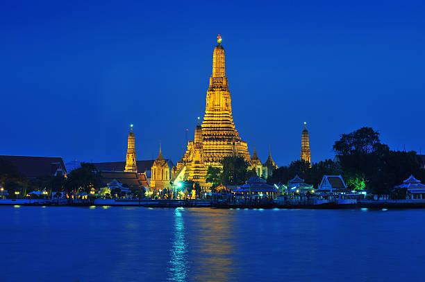 istock Wat Arun across Chao Phraya River during sunset 164147442