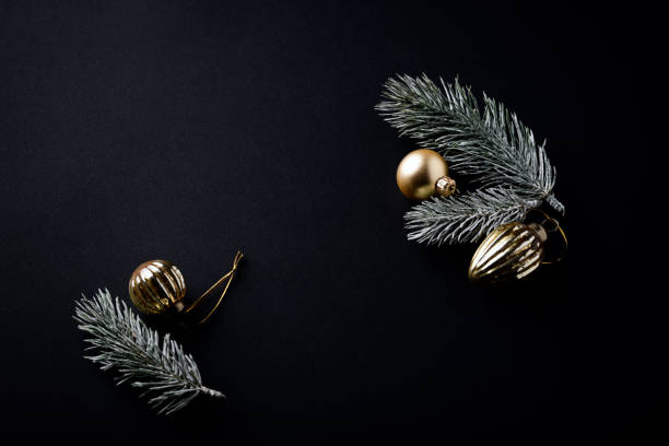 istock Christmas ornaments on dark paper background. Soft focus. Close up. Copy space. 1641479885