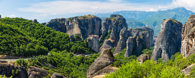 Meteora is a stunning rock formation in Greece with monasteries perched on top. It's famous for its unique landscapes, spiritual significance, and panoramic views. A UNESCO World Heritage Site, Meteora is a blend of natural beauty and cultural history. The Monastery of Rousanou is a beautiful monastery on a rock pillar in Meteora, Greece. It has colorful architecture, frescoes, and a peaceful atmosphere.