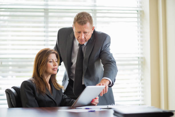 istock Business Colleagues With Digital Tablet In Room 164148579